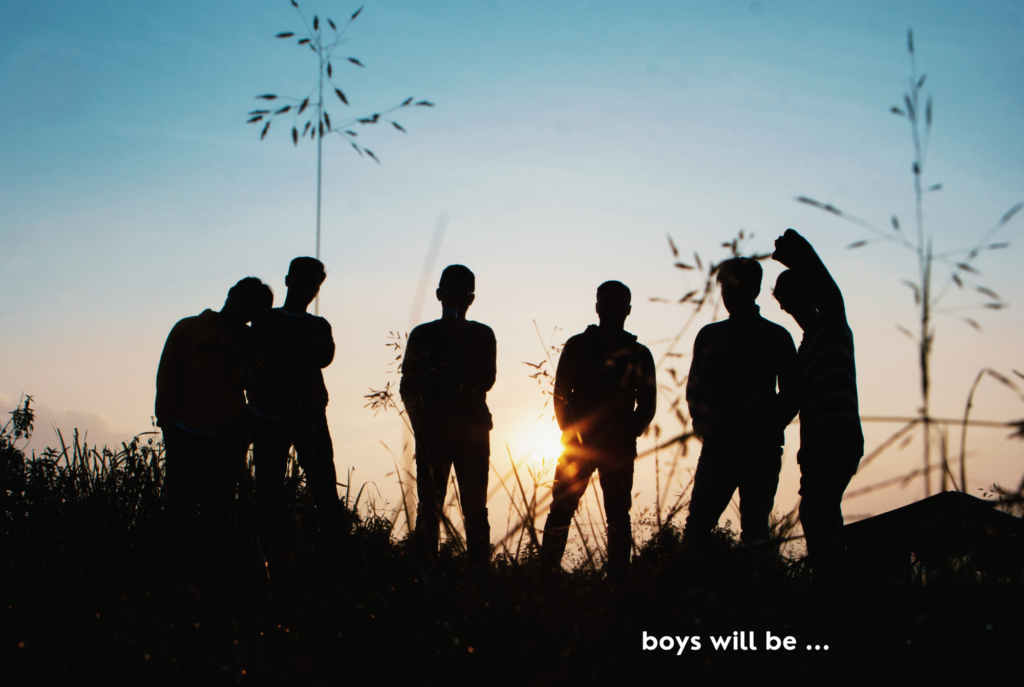 Sunset silhouettes of a group of tween or teen boys