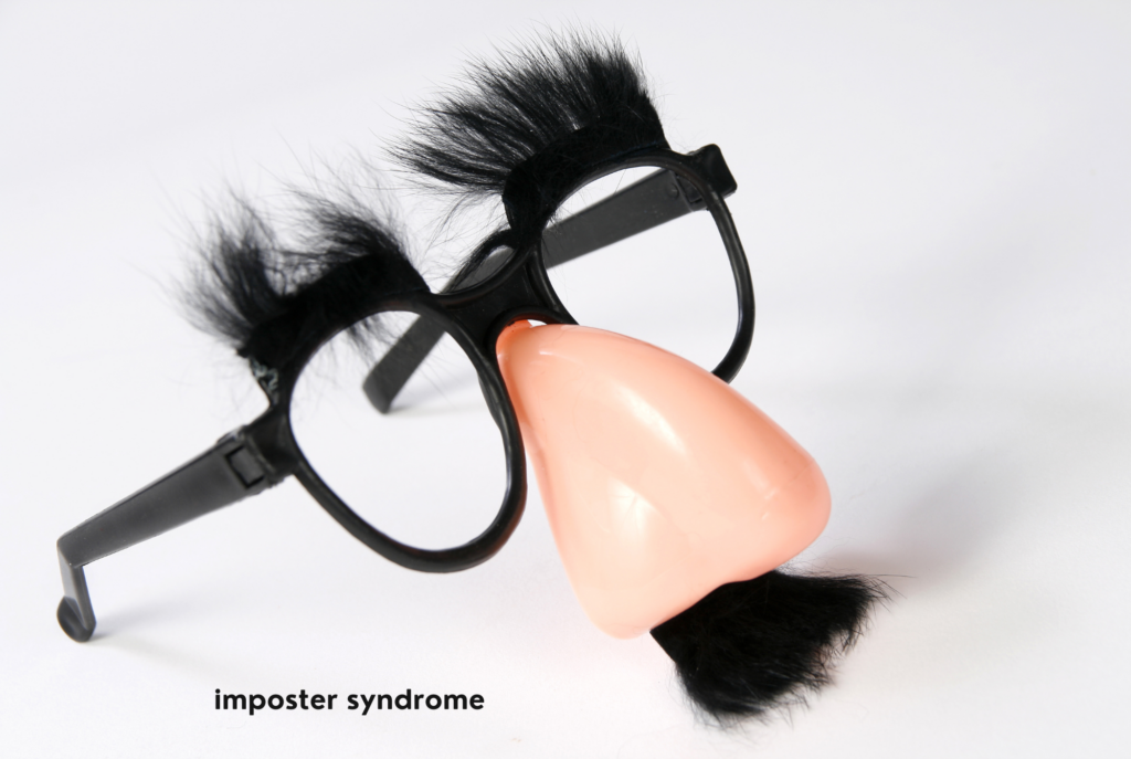 A pair of disguise glasses sit against a white background, representing imposter syndrome for teen and tween girls.