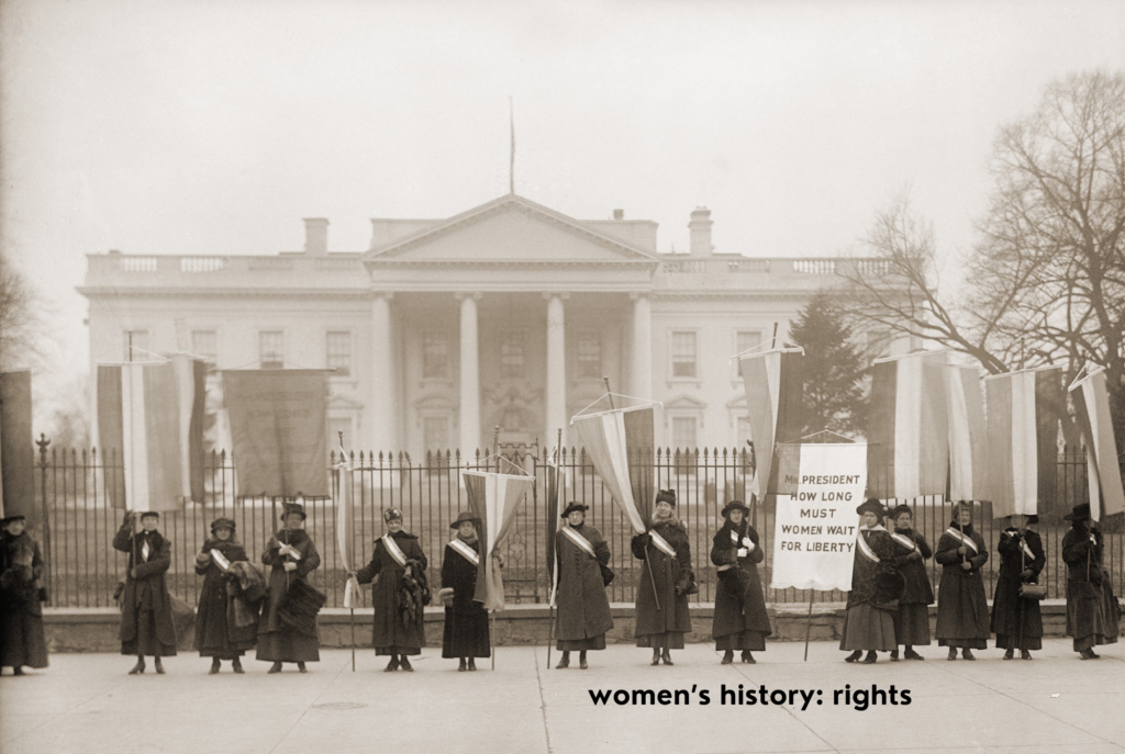 Suffragettes stand in front of the United States White House in support of Women's Voting Rights.